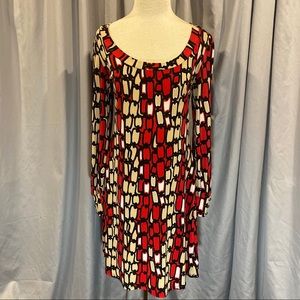 Red & beige pattern dress. No zipper.  Loose fit.  Long sleeves w gold buttons.